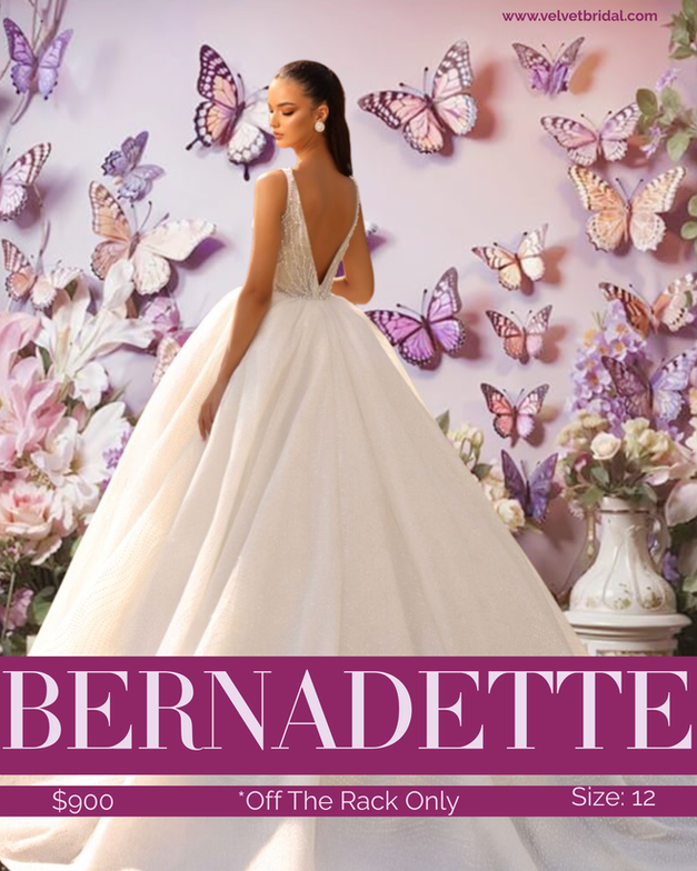 Model wearing the Bernadette wedding gown, a size 12 glitter tulle ballgown with a full skirt and a pearl-embellished bodice. The gown features a sparkling finish and a classic bridal silhouette, photographed in a romantic floral studio setting.