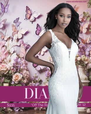 Bride modeling the Diane wedding gown, a fitted soft crepe bridal gown with a plunging neckline, illusion lace side cutouts, wide straps, low back, and a dramatic button-detail train. The gown features matte lace appliqués and a sleek silhouette photographed against a pink floral and butterfly backdrop at Velvet Bridal.