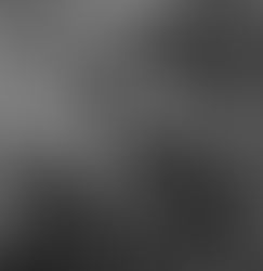 self portrait of a woman smoking a cigarette and staring enigmatically into the middle distance