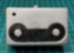 The camera base plate that comes off to reveal the film compartment.