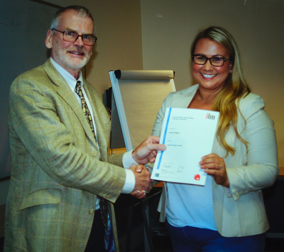Shaking the hand of a man as she received her certificate