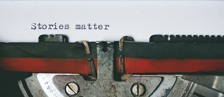 a typewriter saying 'stories matter'