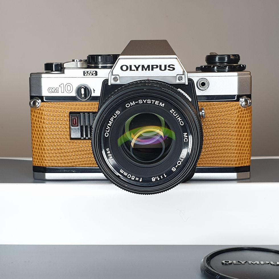 Thumbnail: Olympus OM10 with Zuiko  MC AUTO-S 50mm 1.8 lens. With new TAN leather covering.
