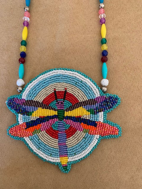 Eye-level view of traditional Native American beadwork on a leather pouch