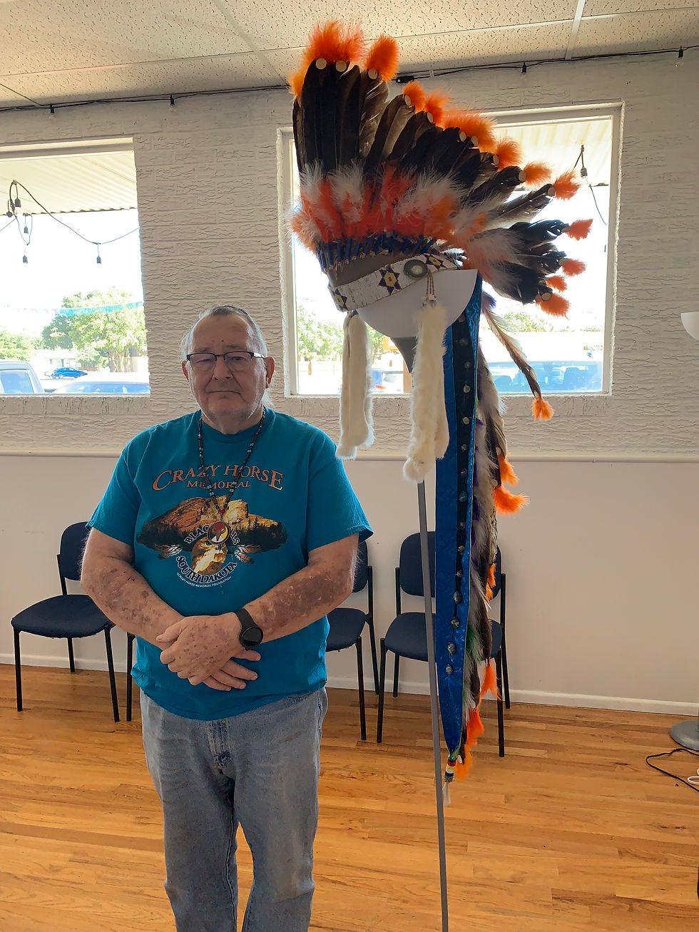 Close-up of a hand weaving a traditional Native American basket