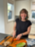 Beth Buchanan cutting a carrot while smilling