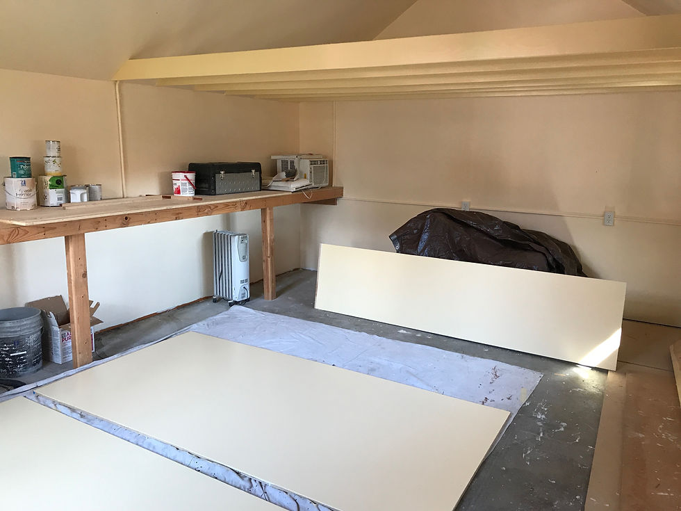 A sunny, interior space being remodeled into a cozy massage studio