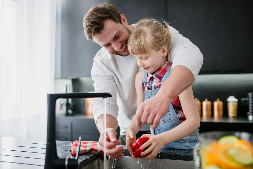 girl-helping-father-wash-vegetables.jpg