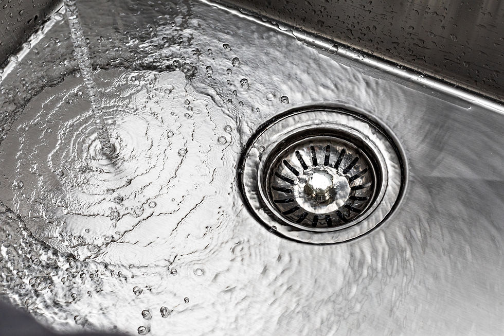water-drains-down-stainless-steel-sink.jpg
