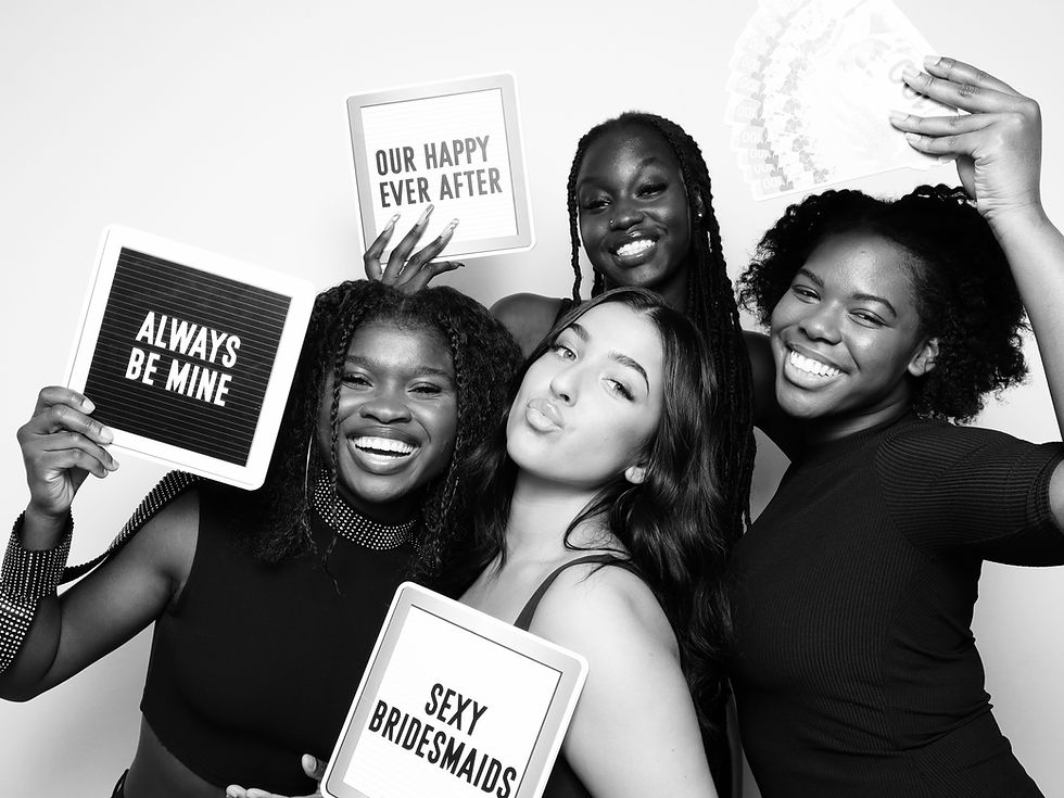 Friends using a photo booth