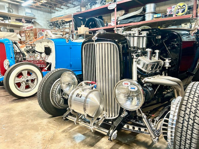 Baby Blue 1932 Ford Roadster and Black 1932 For Roadster with MOON Fuel Tank, Valve Covers and Breathers, MOON Remote Reservoir Tank.