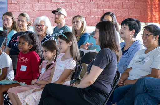 Crowd of people watching a puppet show