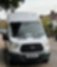 White minibus from the front, waiting to pick up customers