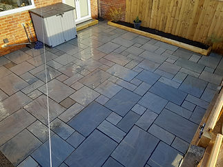 Birds eye view of a newly installed modern grey paved patio