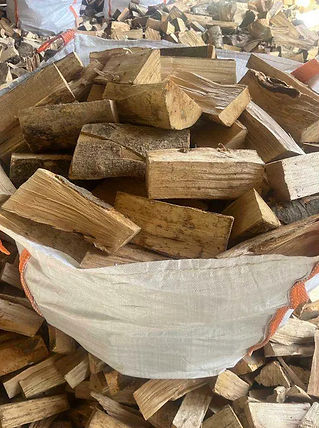 Bags of kiln dried firewood being sorted for customers