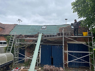 Roofer completing a re roof for a customers home
