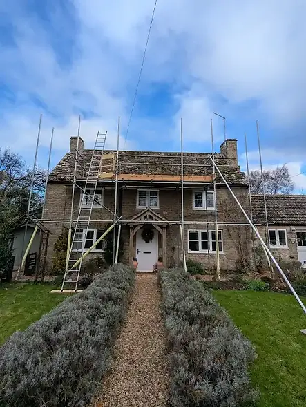 Old stone house having a new roof installed