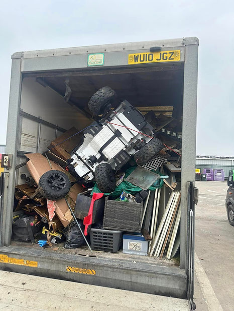 Luton van filled with domestic household waste being disposed of