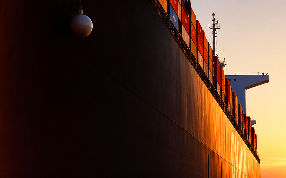 Close-up of a container ship’s hull illuminated by the setting sun.