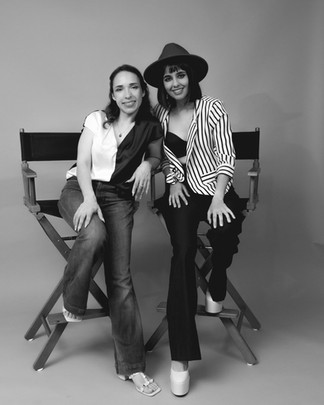 Emmy-winning journalist Irene Díaz in a soft-lit gray backdrop photoshoot directed by Yavi Reyes, styled for a minimalist branding session