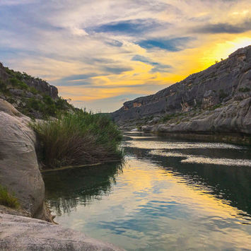 Sunset over tranquil river canyon