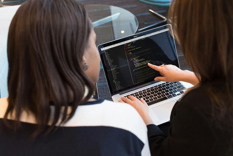 Engineers reviewing ServiceNow workflow automation code
