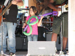 Lily plays balloon guitar