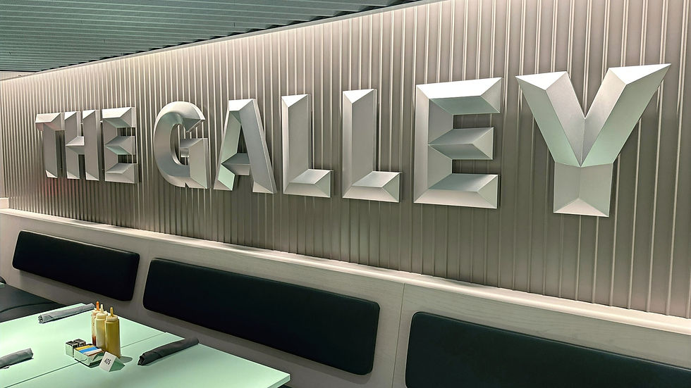 The Galley's logo on a metal wall