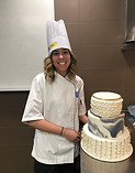 pastry student with wedding cake