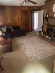 Original living room before renovation with carpet flooring and dated layout, Charlotte NC