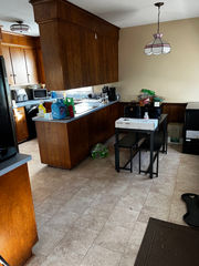 Kitchen before remodel with wood cabinets and older appliances, Charlotte NC renovation