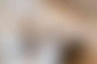 White kitchen with large island, wood beam ceiling, and pendant lights, South Charlotte kitchen remodel.