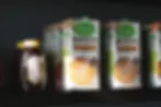 Barista oat milk on the shelf in a cafe.