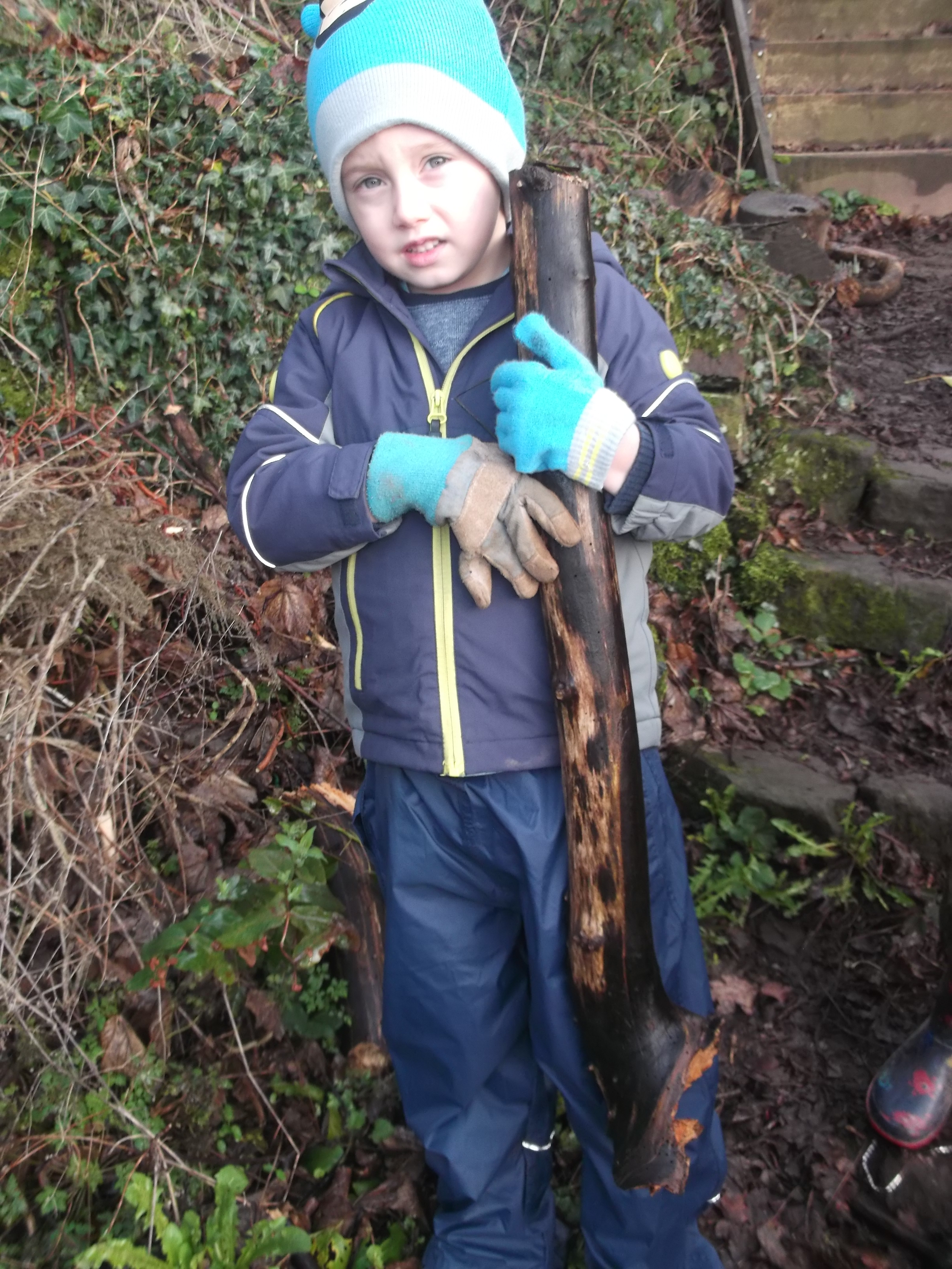 Infants working on the allotment