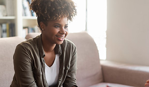 positive-african-lady-smiling-while-listening-therapist.jpg