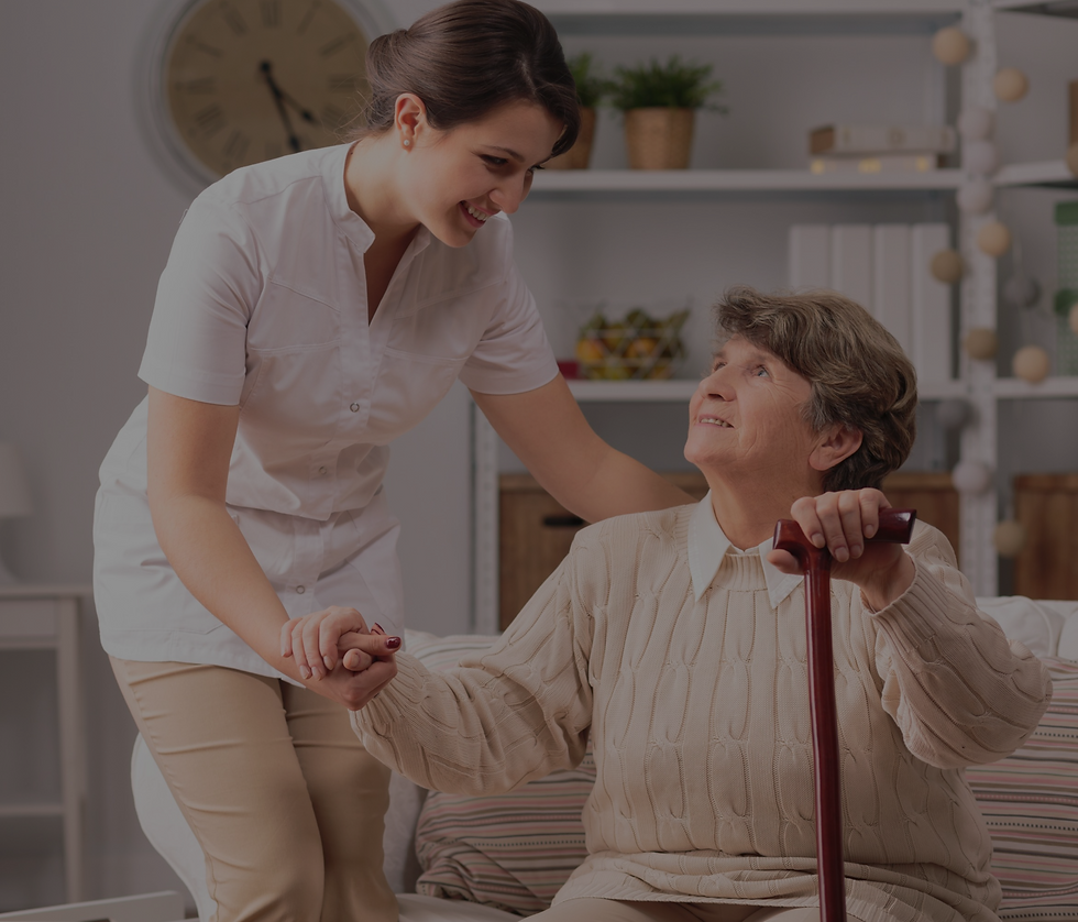 Young carer supporting senior disabled woman with walking stick_edited_edited_edited.png