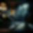 A black dial-up telephone standing in dark and sparsely lit room, the atmosphere is vaguely threatening