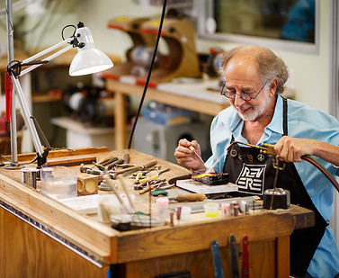 Alan_smiling_soldering_at_bench-128.2.jpg