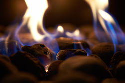 close-up-of-flaming-coals-on-gas-fire-2021-08-26-16-12-48-utc
