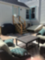 Backyard grill and seating.
