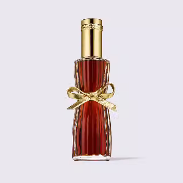 Elegant perfume bottle with gold bow