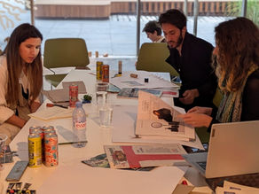Employees engaging during a art curated engagement activity in workspace