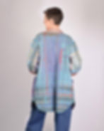Thumbnail: Person wearing purple and teal long quilted jacket - back view