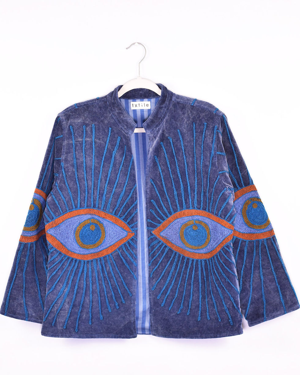 blue velvet jacket with embroidered evil eyes on it - front view