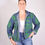 Thumbnail: Person wearing denim jacket covered in kelly green embroidery - front view