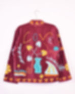 maroon colored velvet jacket with flowers and the word love embroidered on it
