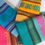 Thumbnail: Four colorful Mexican napkins folded on a table