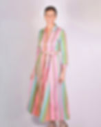 person wearing shirt dress made of a green and bright pink woven fabric - front view