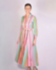 person wearing shirt dress made of a green and bright pink woven fabric - front view