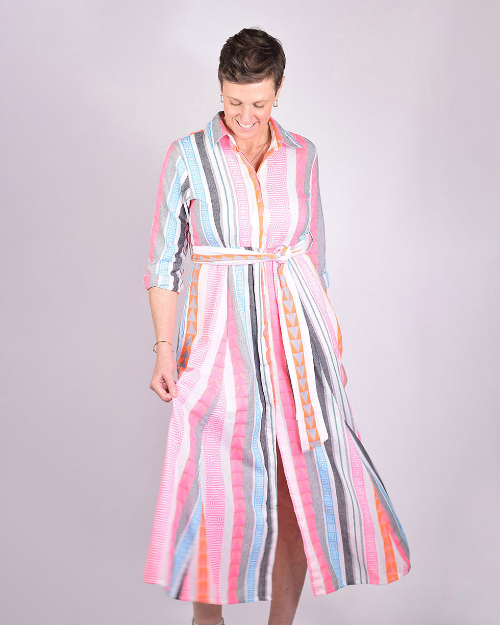 person wearing white, blue and neon striped dress - front view